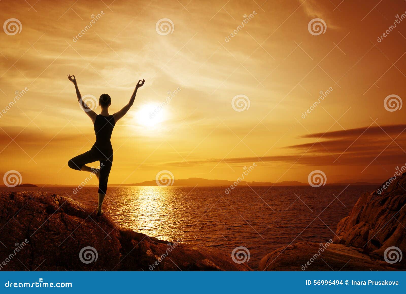 yoga meditation concept, woman silhouette meditating in nature
