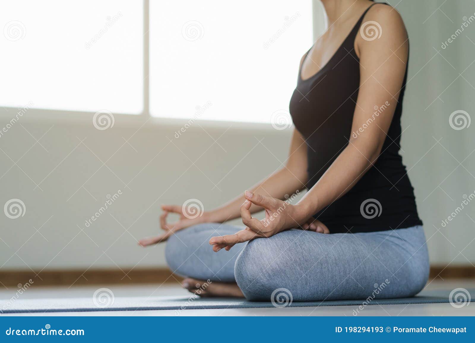 Young Beautiful Woman Meditating At Home Stock Photo 