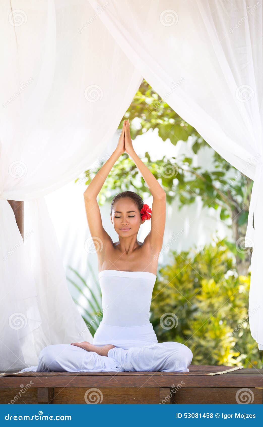 yoga in the morning with sun ray through the baldachin