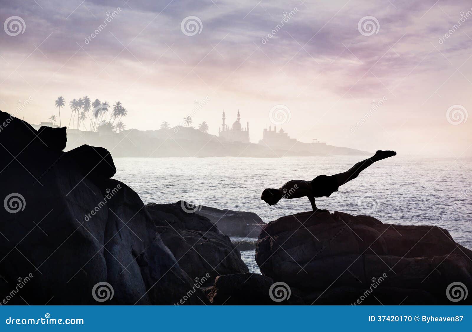 Yoga on the rock stock photo. Image of black, balance 37420170