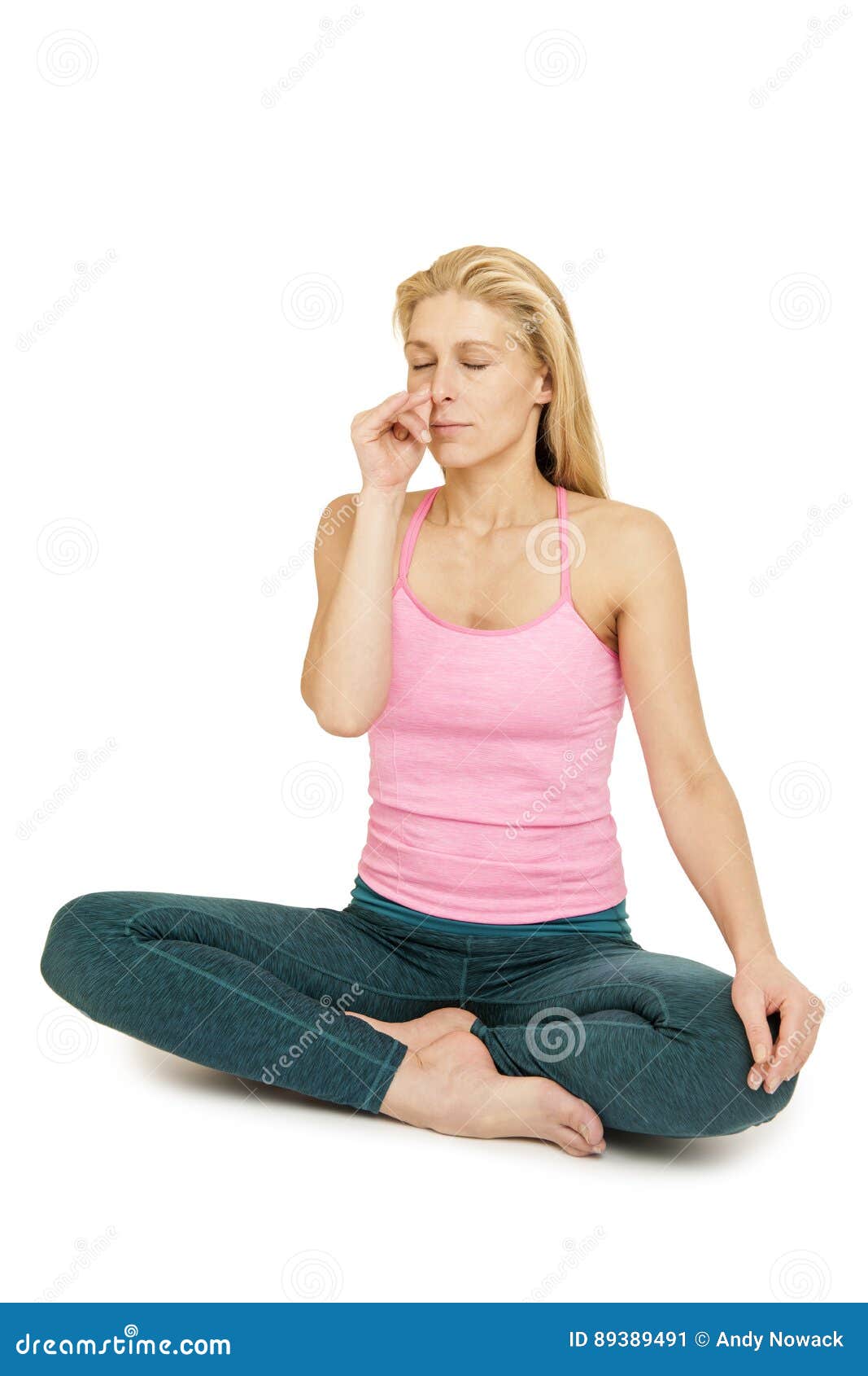 Woman practicing yoga Padmasana, lotus pose with closed eyes Stock Photo by  ©pavel_kolotenko 225054868