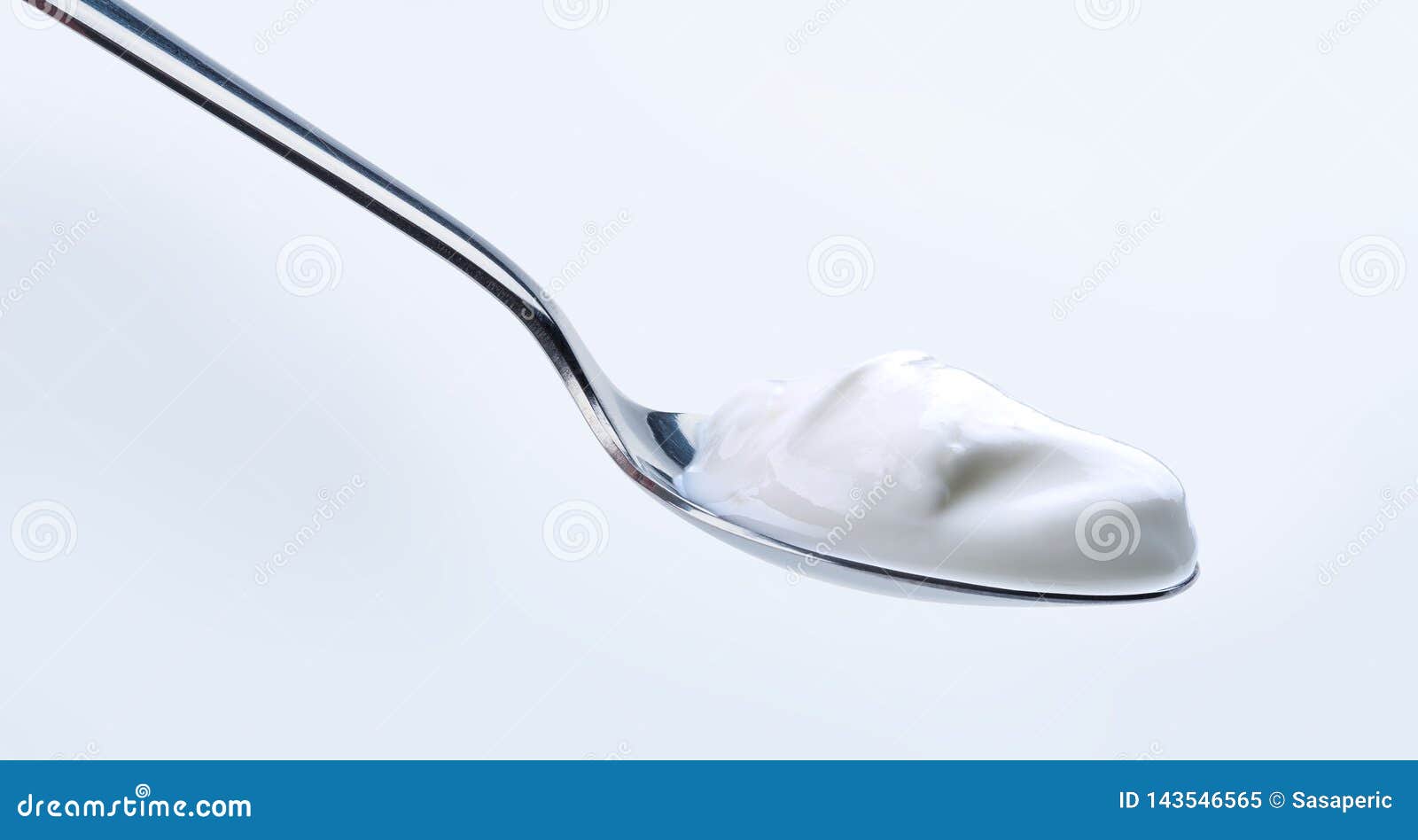 Yoghurt on silver spoon stock image. Image of sauce 143546565