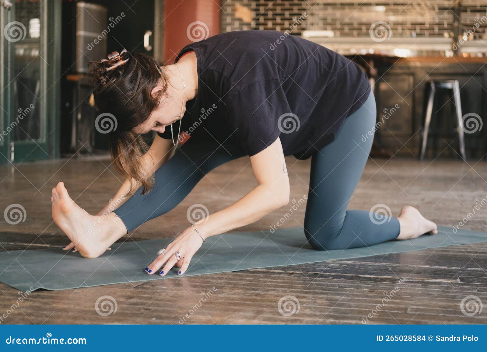 Yoga Indoors: Wide Leg Seated Hamstring Stretch Stock Photo