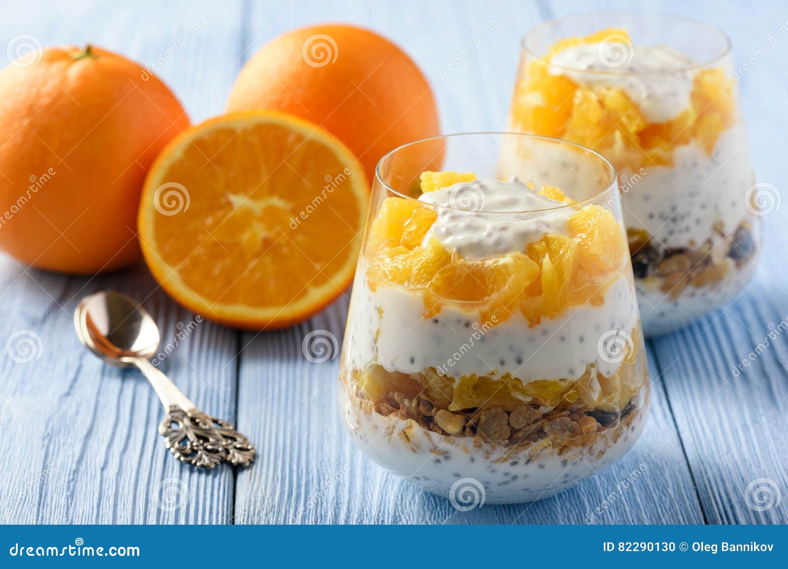 Yogurt Dessert with Muesli, Chia Seeds and Oranges. Stock Photo Image