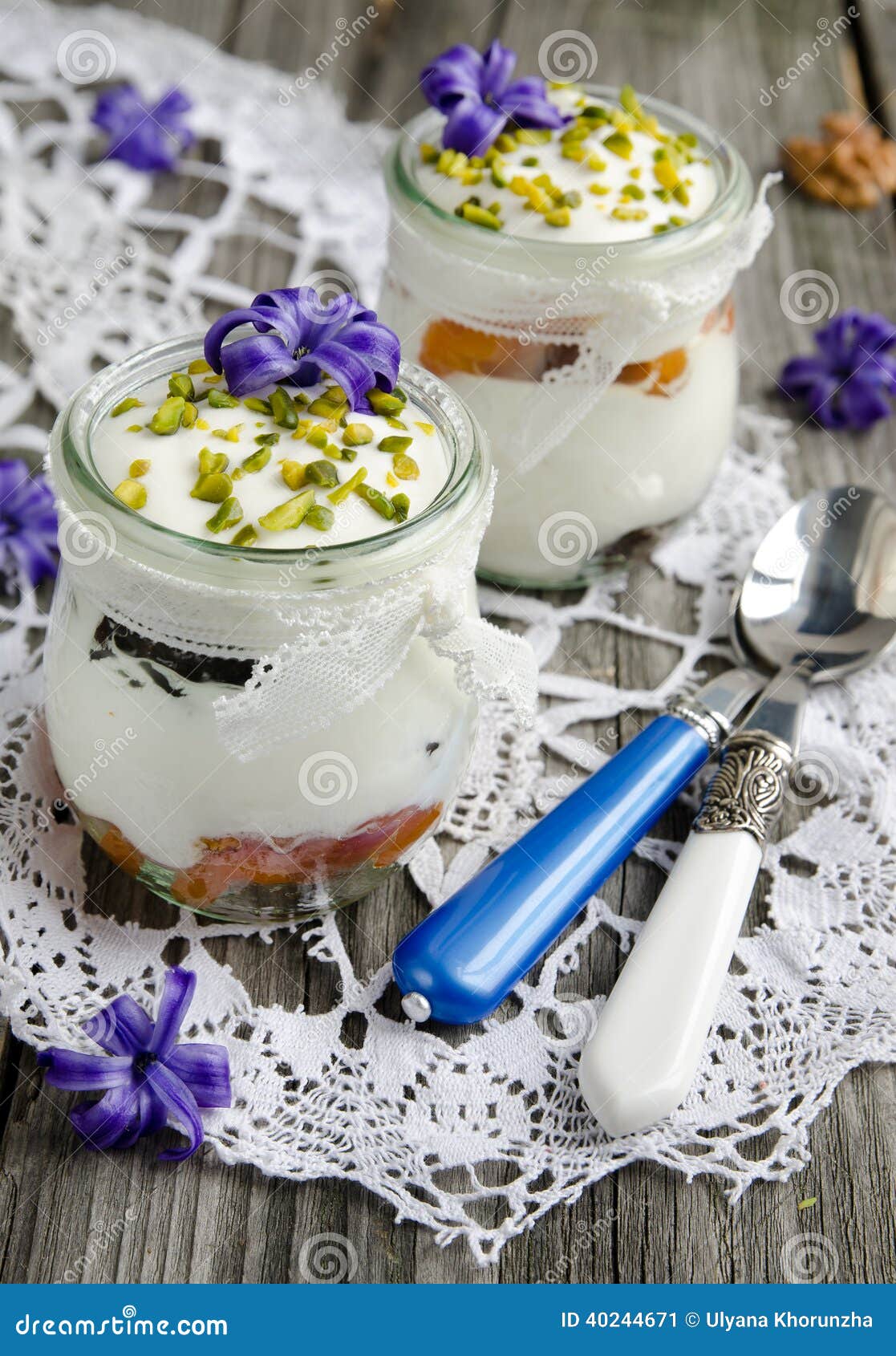 Yogurt with dried fruit, decorated with blue hyacinths