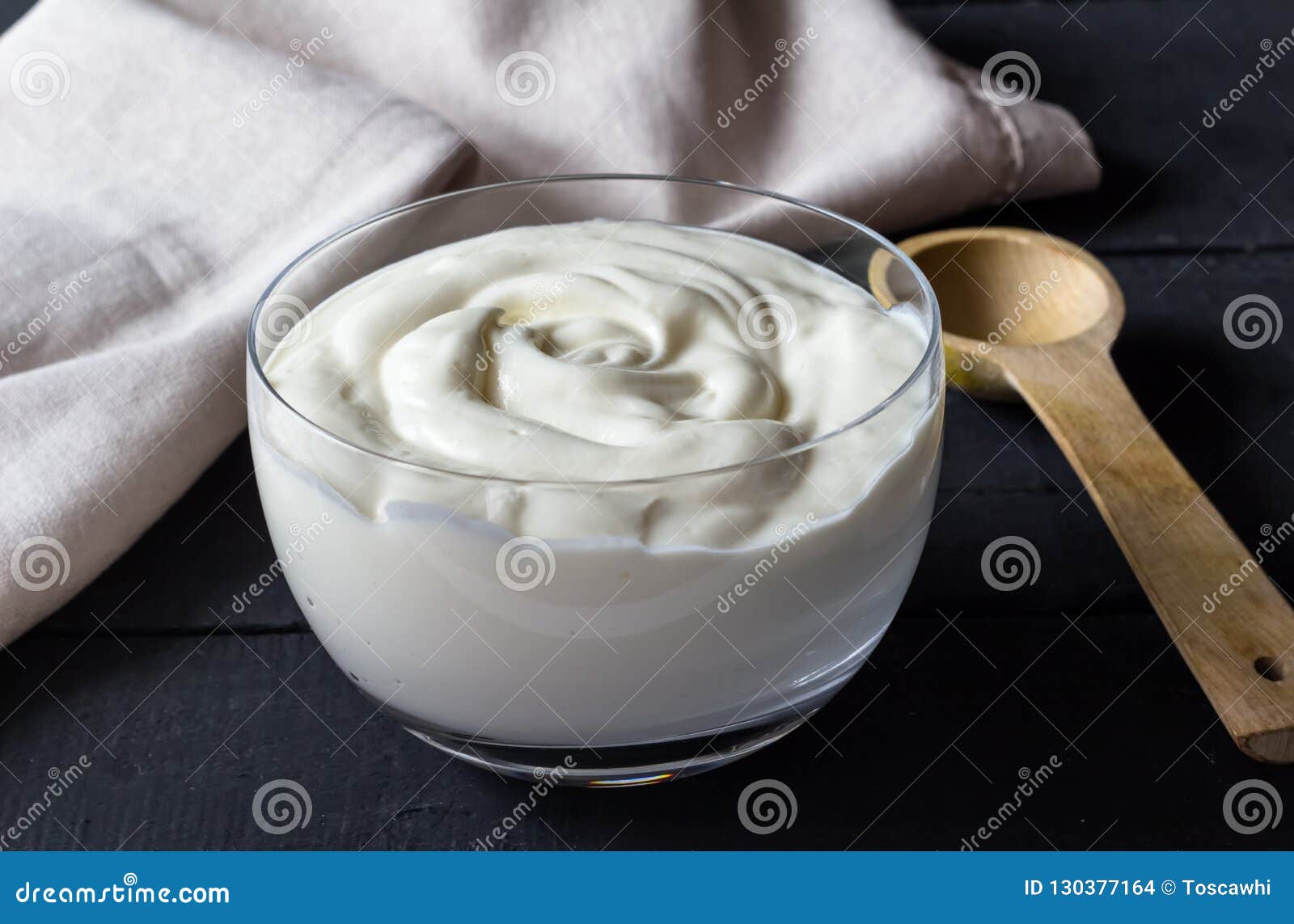 https://thumbs.dreamstime.com/z/yogurt-glass-bowl-wooden-spoon-selective-focus-natural-greek-yoghurt-background-130377164.jpg