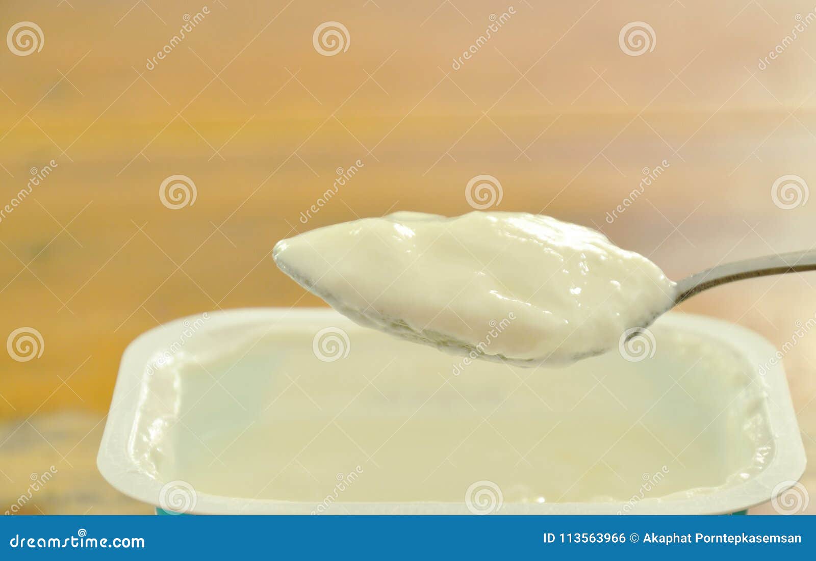 Yogurt Scooping on Spoon from Plastic Cup Stock Photo Image of juicy