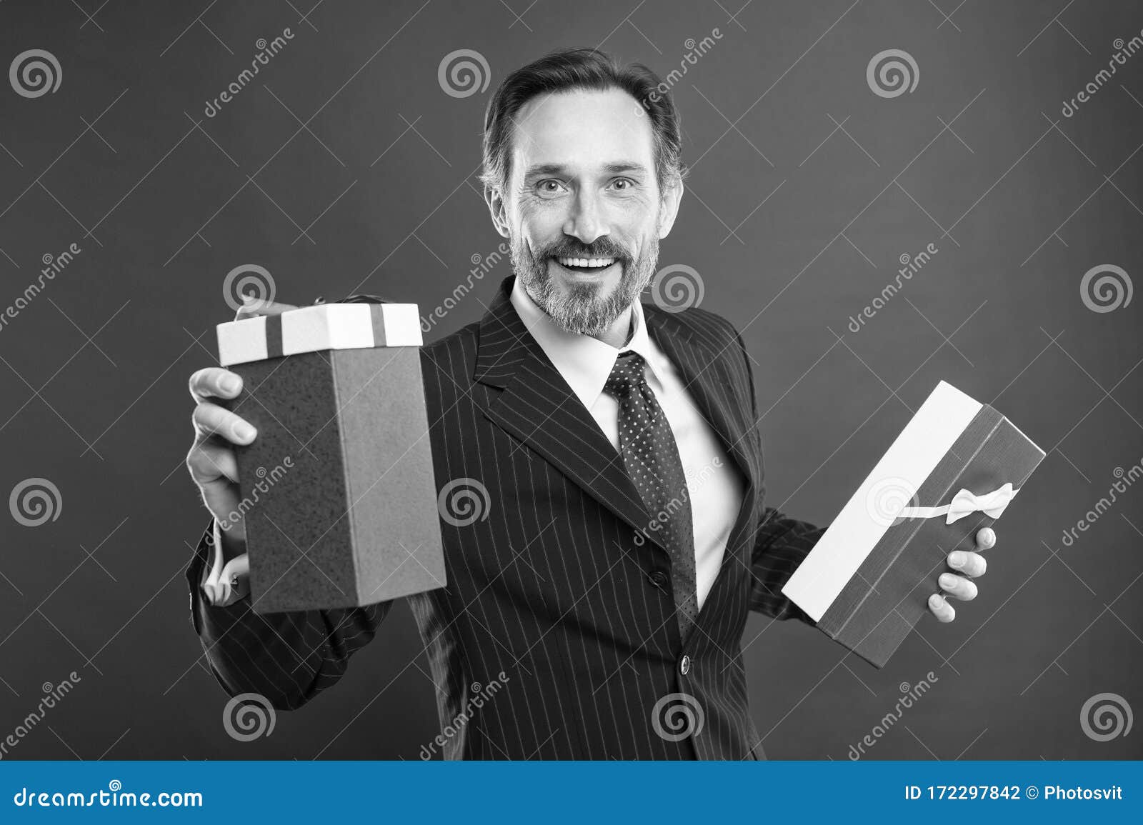 For You. Happy Businessman Give Presents Red Background. Mature Man