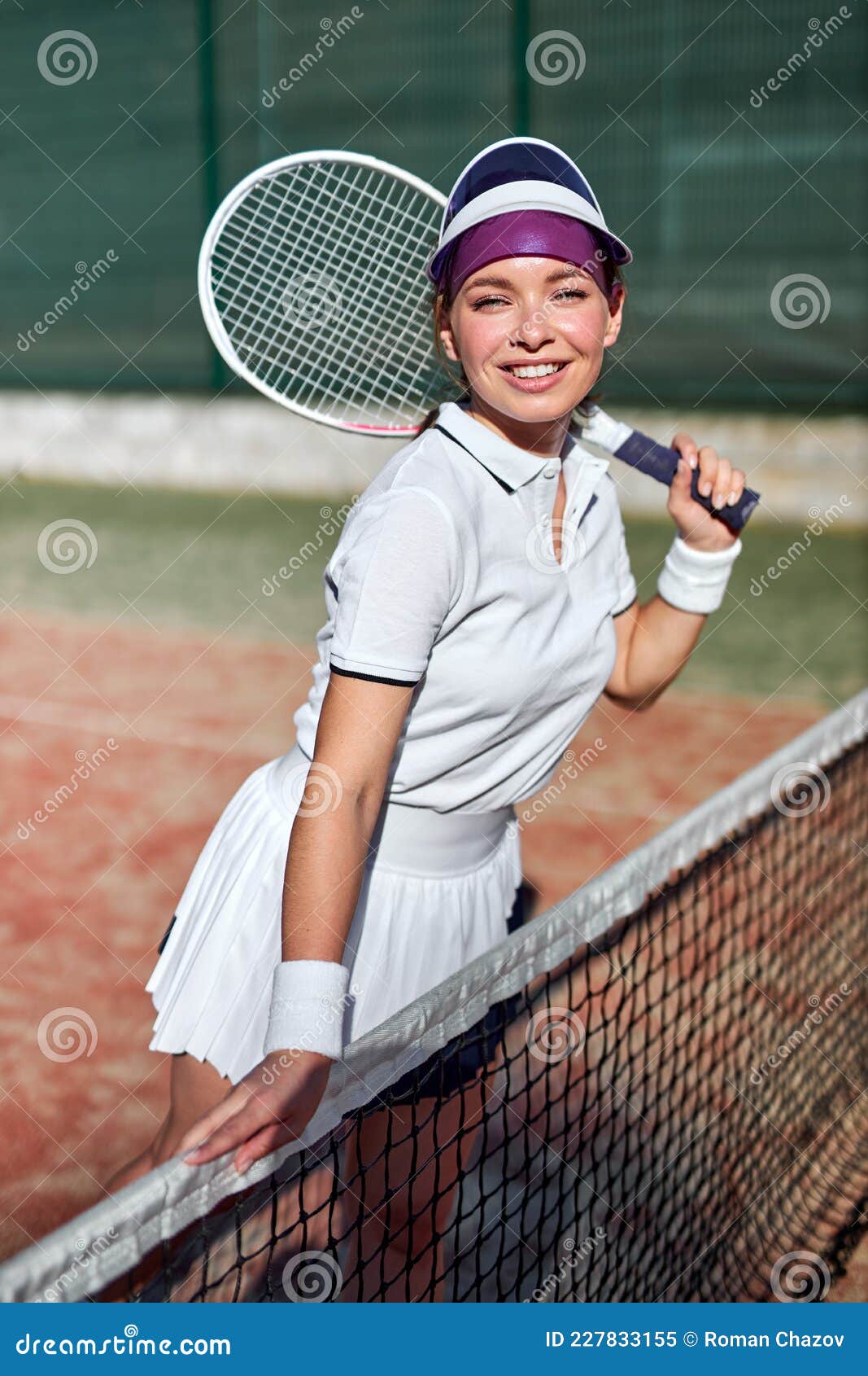 Beautiful Young Woman In Sports Clothing Holding Tennis Racket On