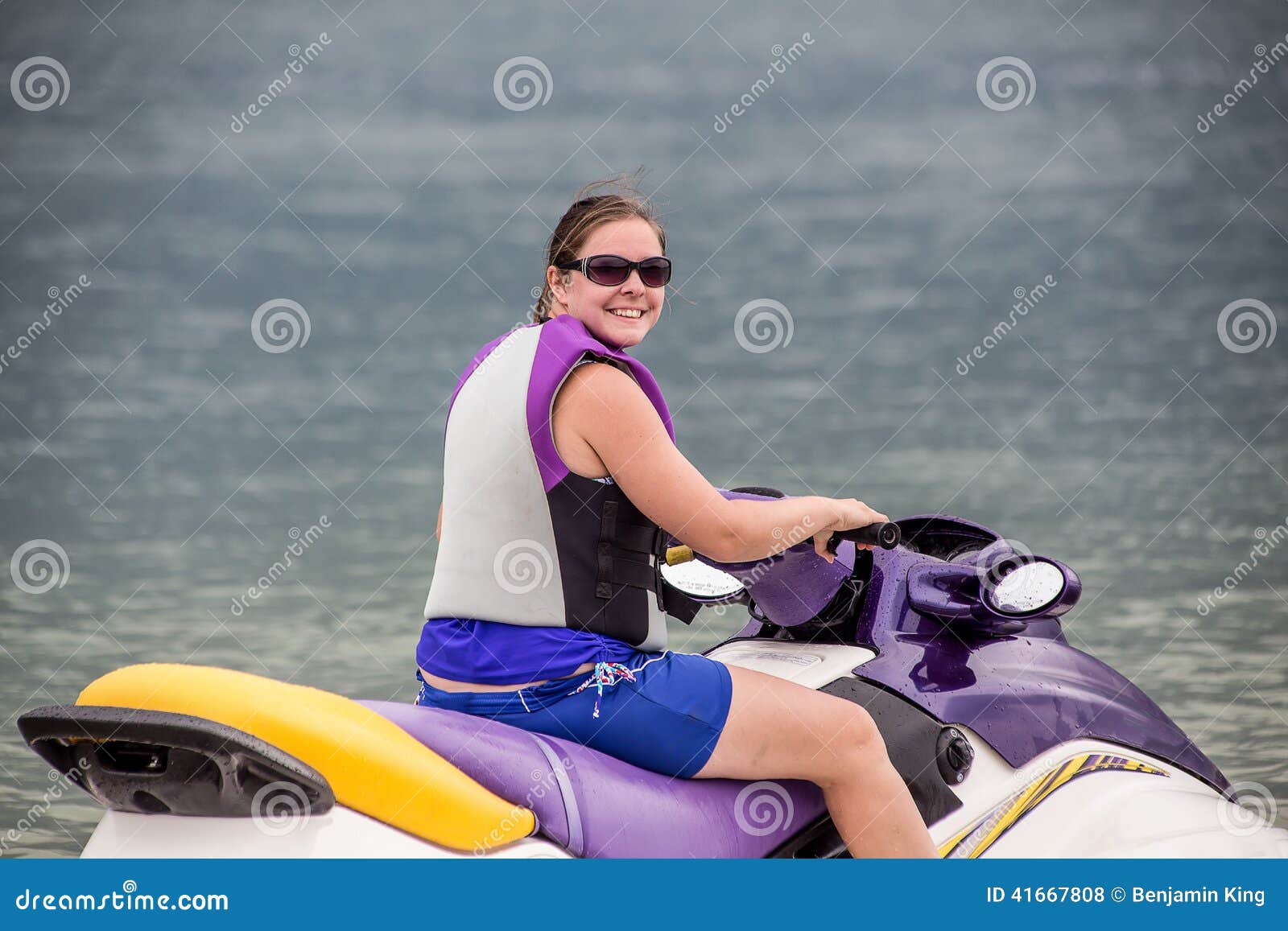 yound woman riding a jet ski stock photo - image of vessel