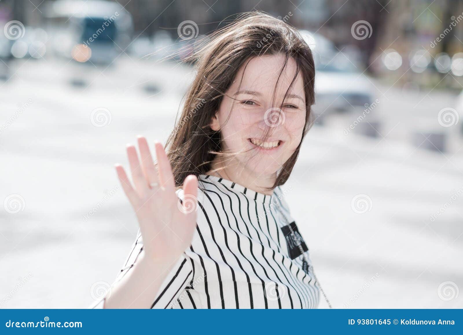 A Young Active Girl Waves Her Hand To Say Goodbye. Stock Image Image