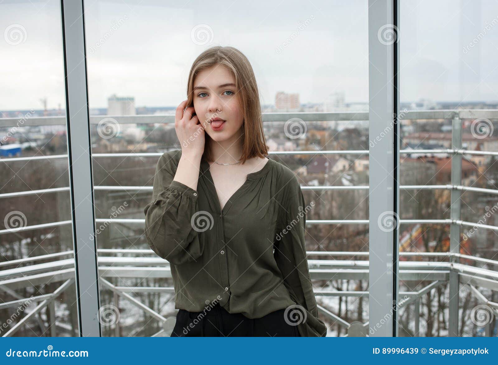 Student Pussy - Young Adorable Student Blonde Teen Girl Touching Hair Showing Tongue Having  Fun on the Observation Deck with a View of Cloudy Spri Stock Image - Image  of european, happy: 89996439