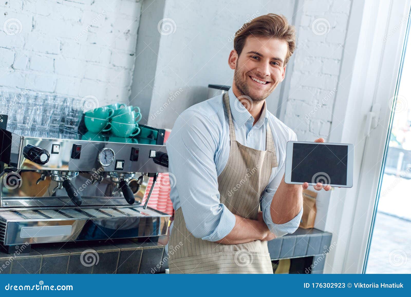 Download Young Adult Barista Working In Coffeeshop, Showing Tablet With Copy Space On Display Stock Image ...