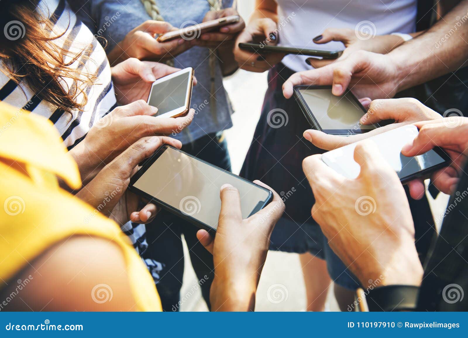 young adult friends using smartphones together outdoors youth cu
