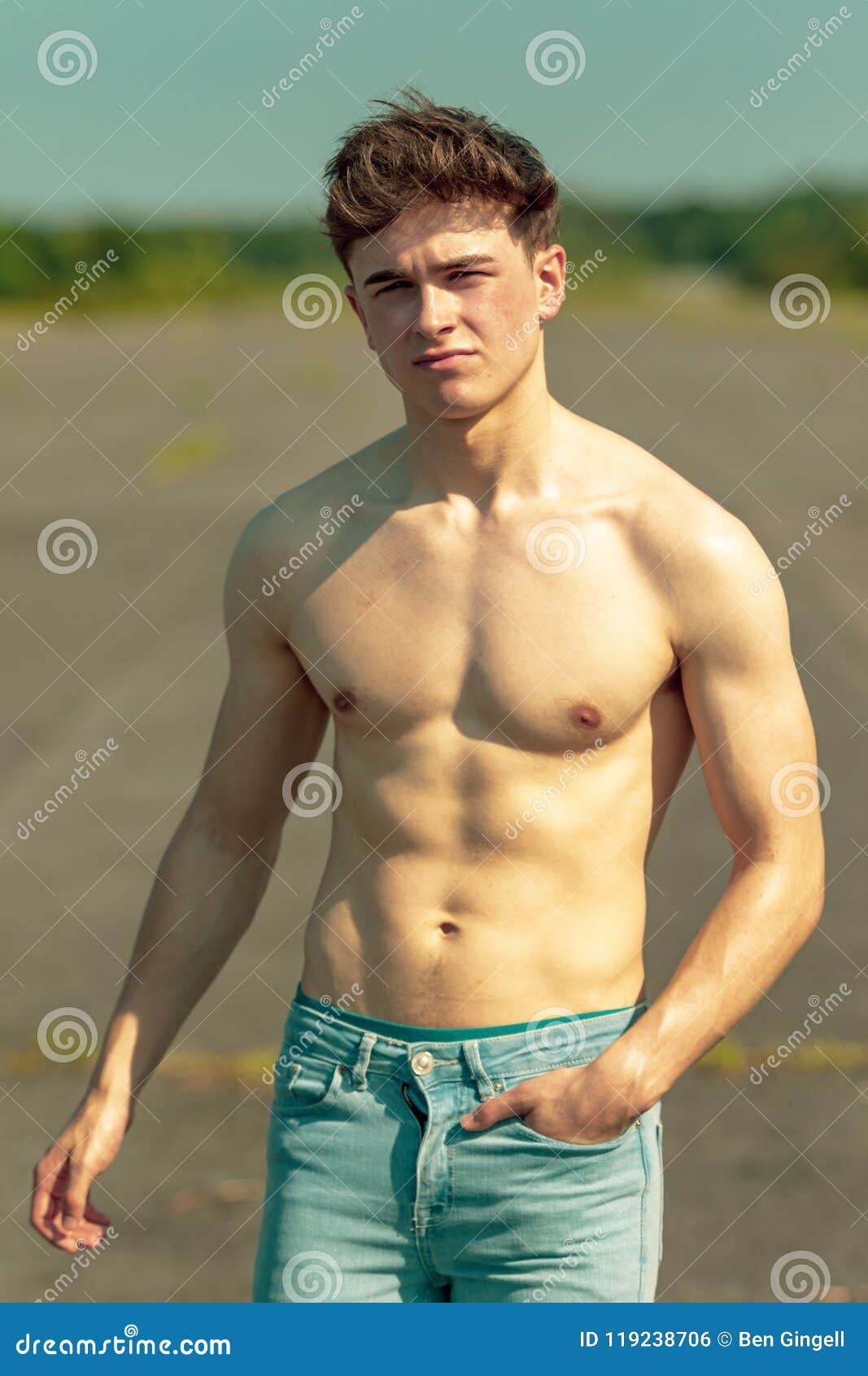 Young Adult Male Shirtless Outdoors Stock Photo - Image of standing ...