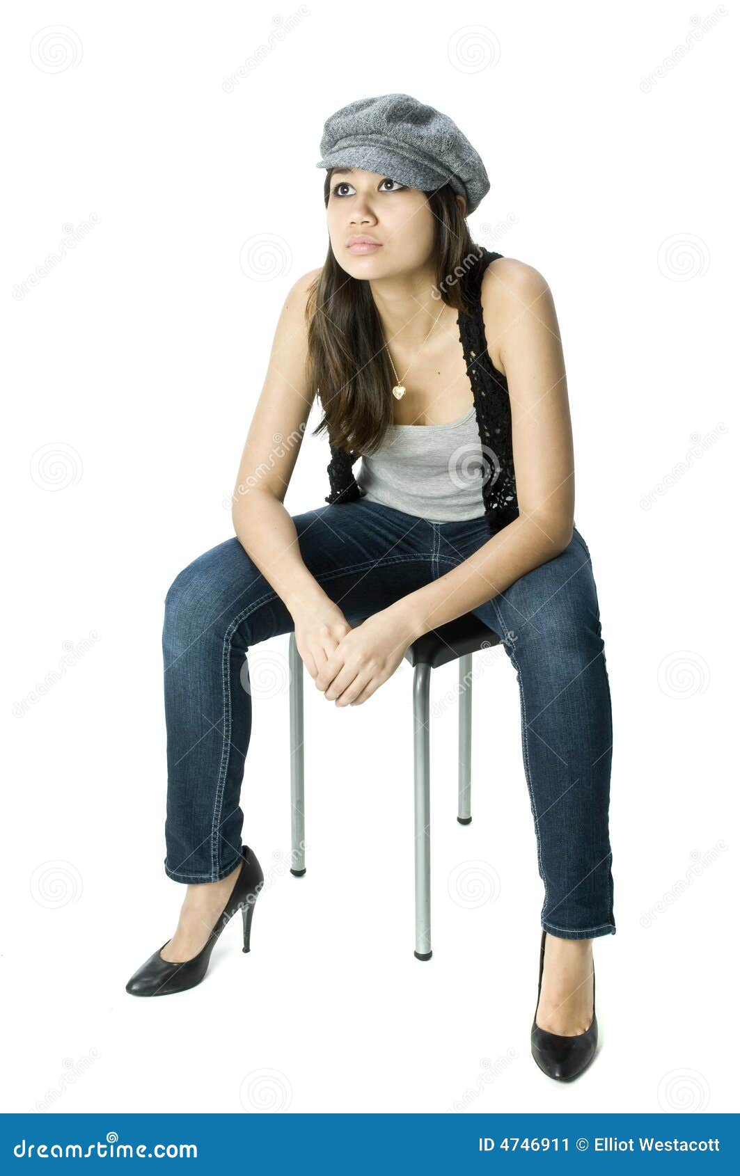 Young Adult Sitting on a Stool Stock Image Image of casual, heals