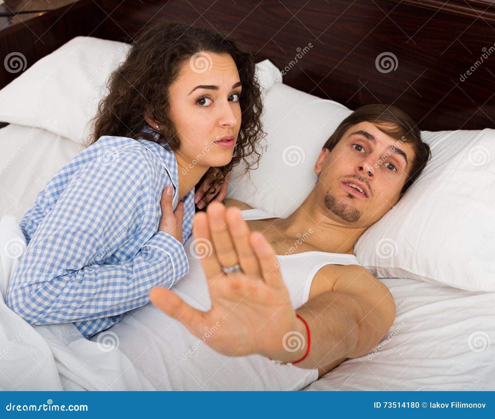 Young Adults Caught Having Sex in Bed Stock Photo