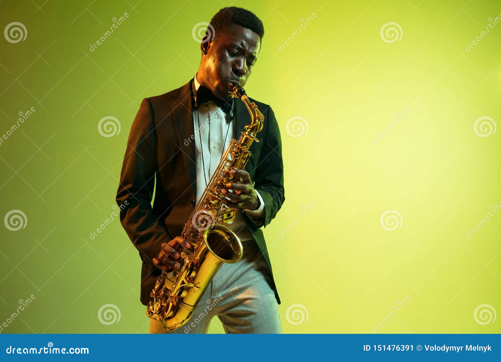 young african-american jazz musician playing the saxophone