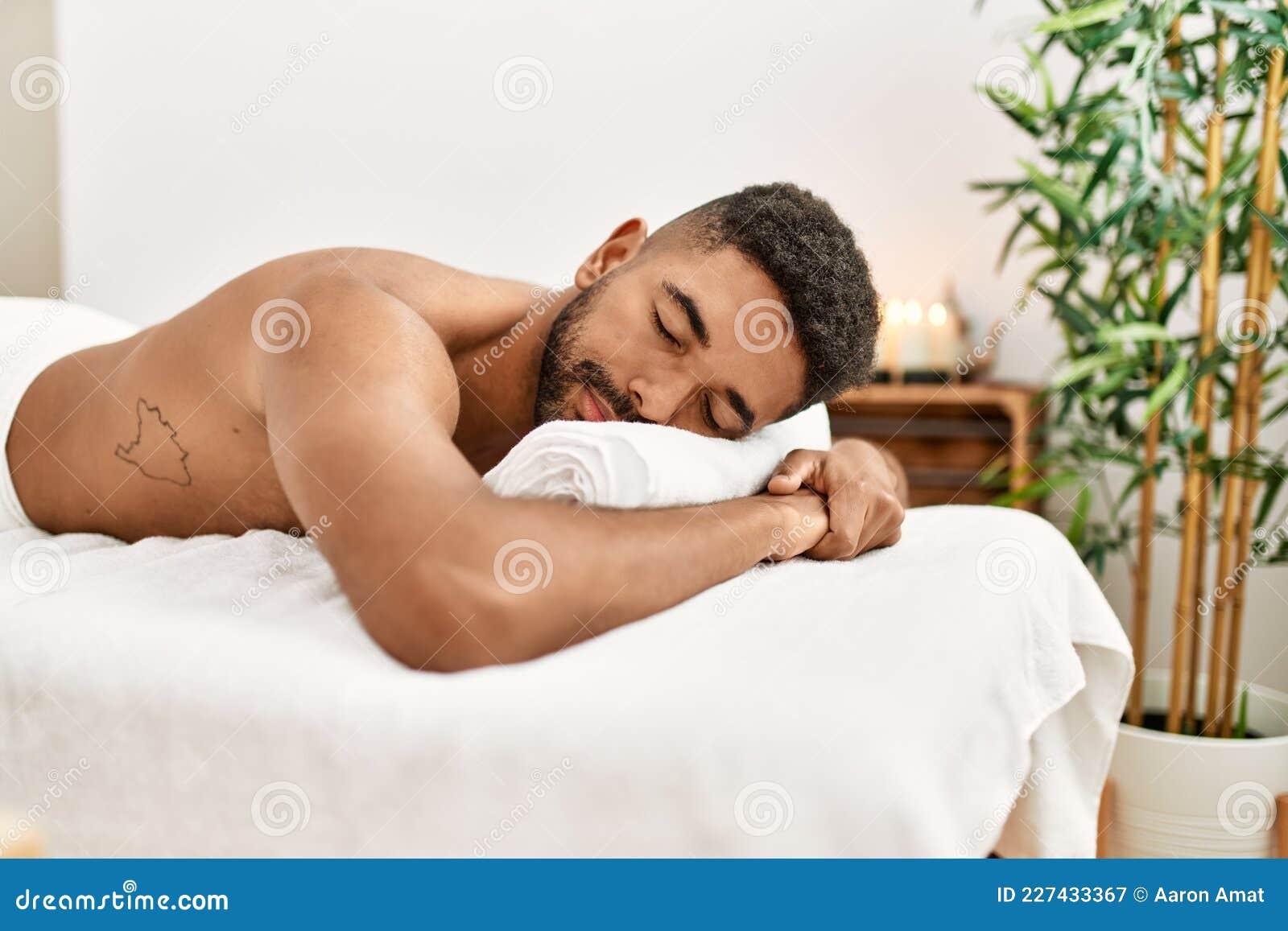 Young African American Smiling Happy Relaxed Lying on Massage Table at  Beauty Center Stock Image - Image of physiotherapy, black: 227433367