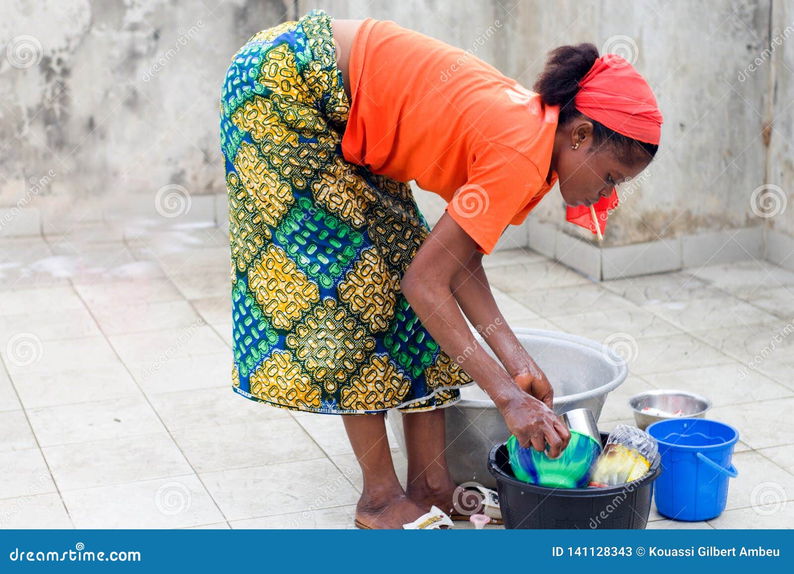 Traditional Job Of Washing Girls Body Young woman washes dishes stock image. Image of benin - 141128343