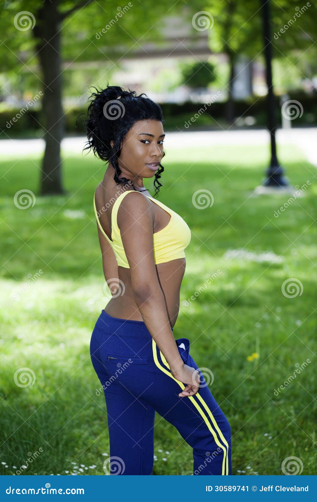 Young African American Woman Sweat Pants Yellow Top Stock Image