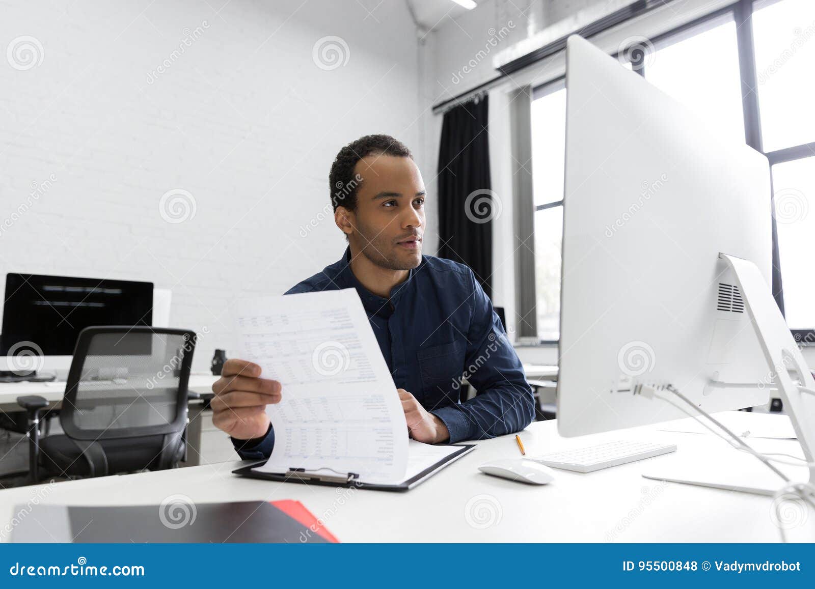 young african business man sitting at his desk