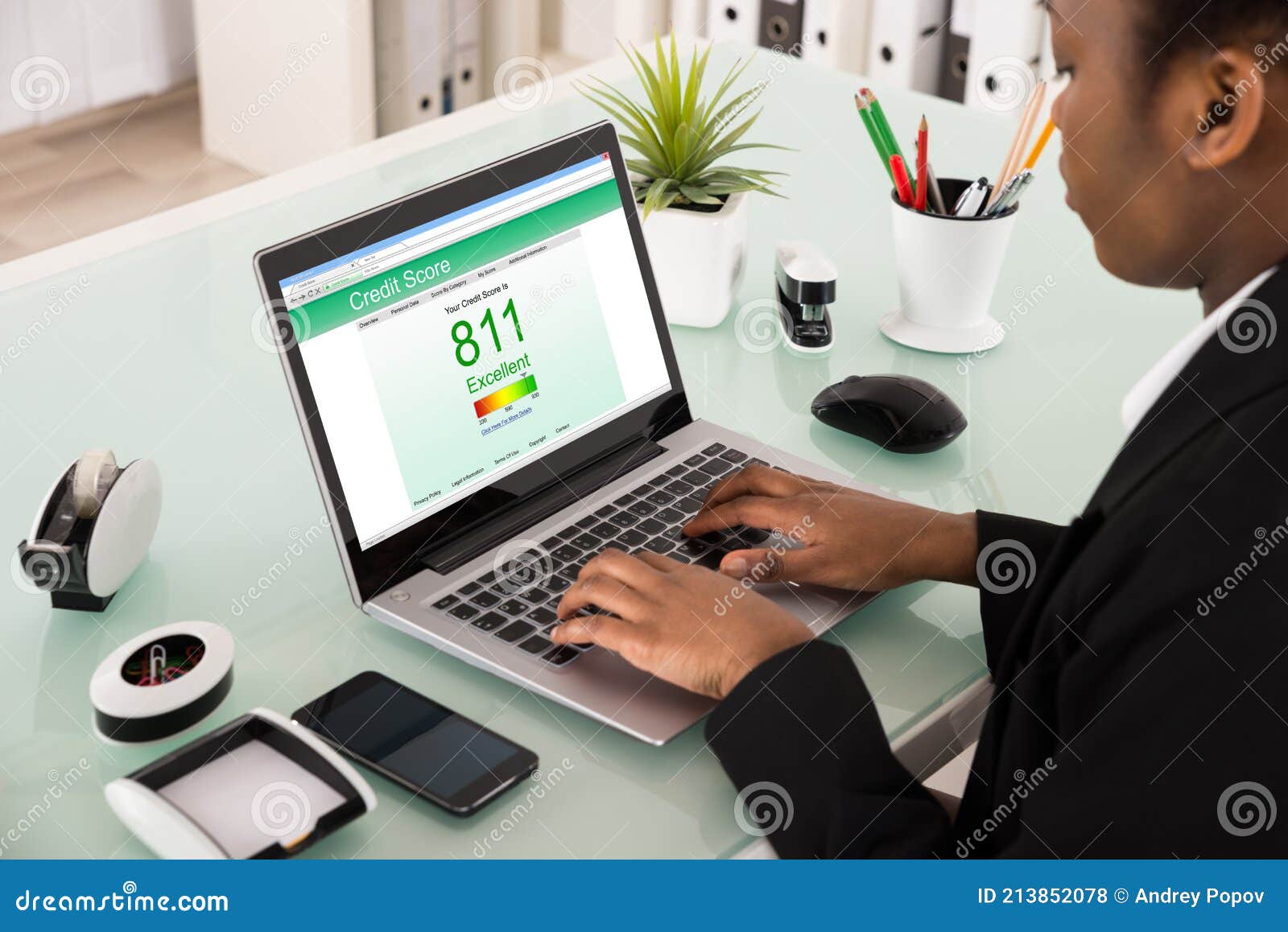 businesswoman checking credit score on laptop