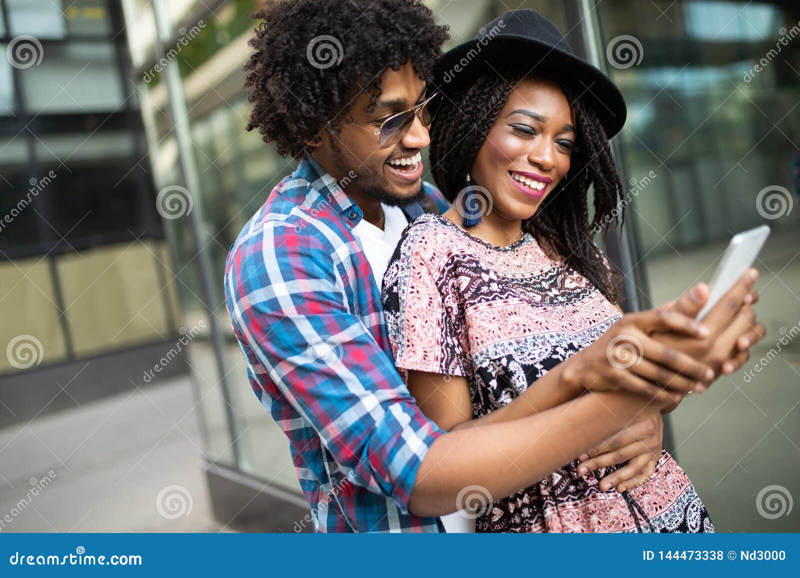 Happy young couple kissing and posing in park nature, taking selfie by  mobile phone Stock Photo | Adobe Stock