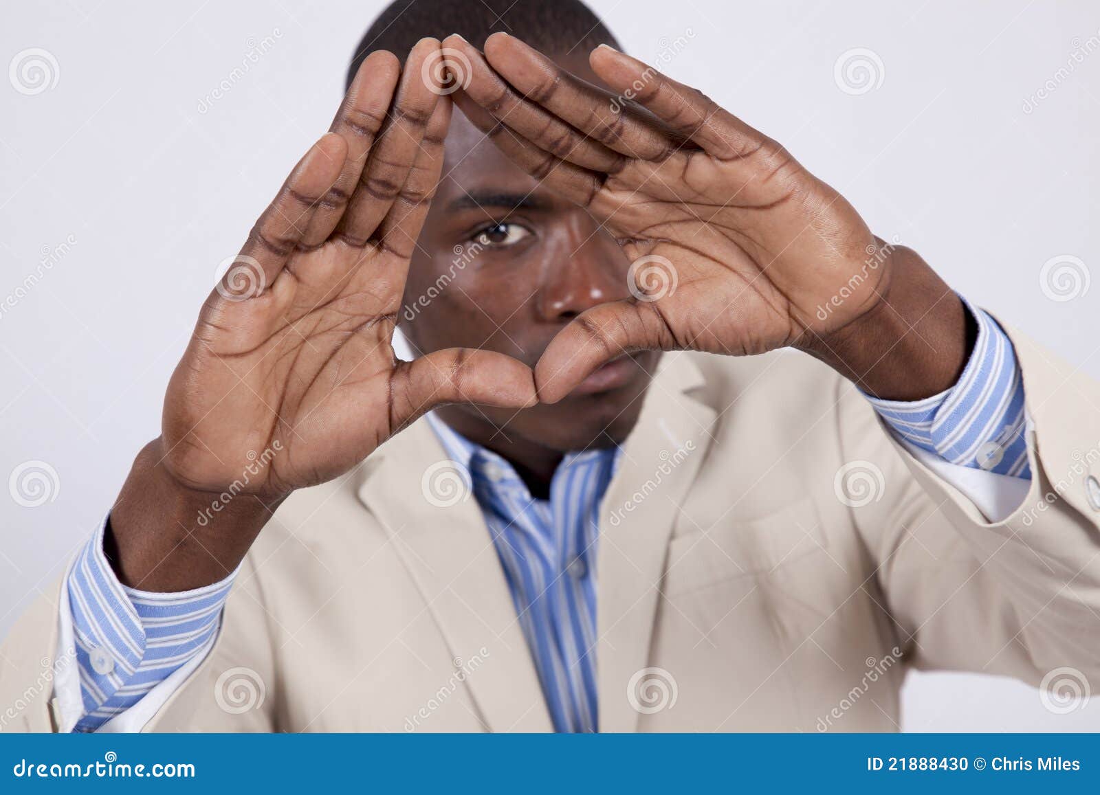 Young African Man Looking through His Hands Stock Photo Image of