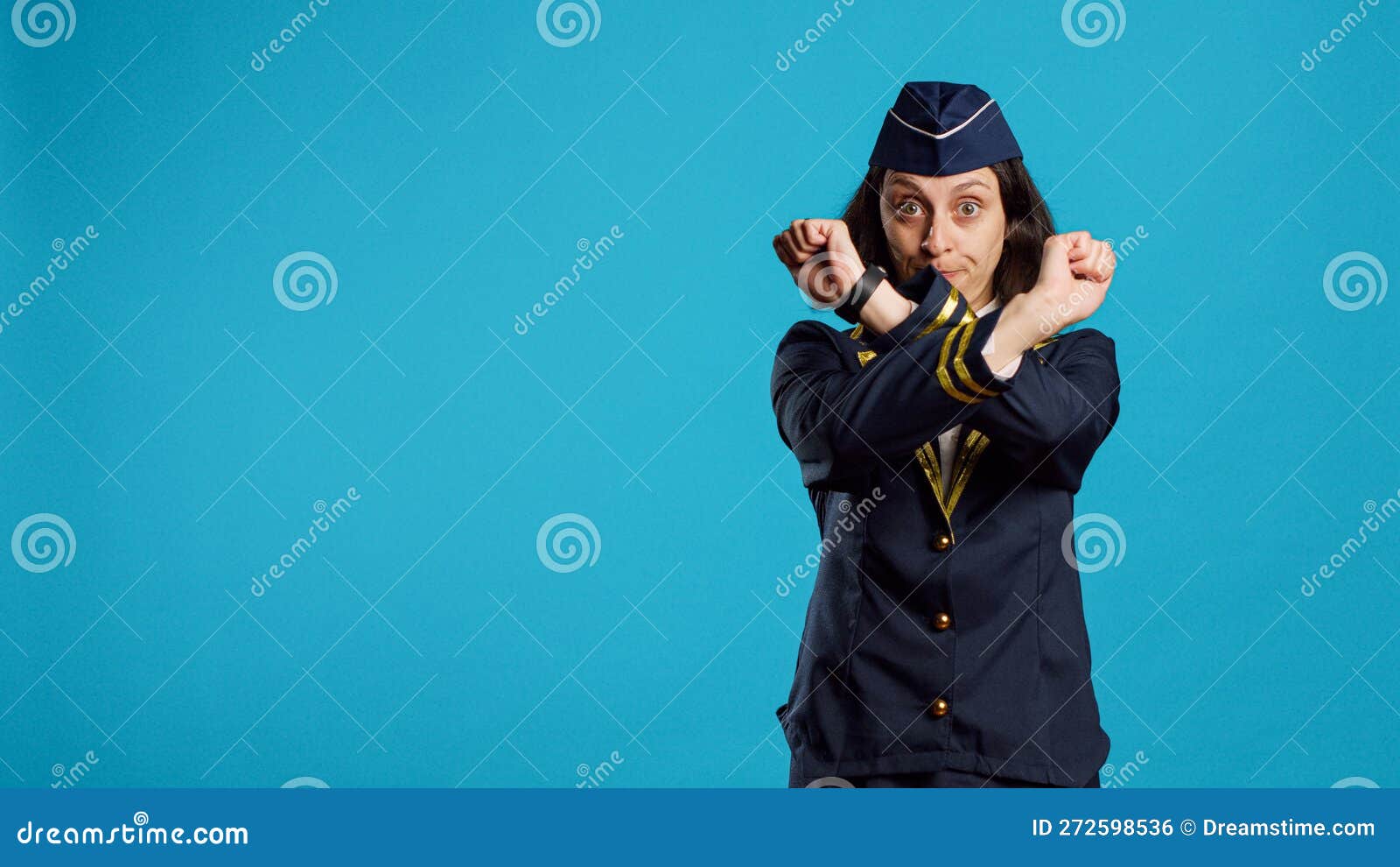 young air hostess doing x  gesture