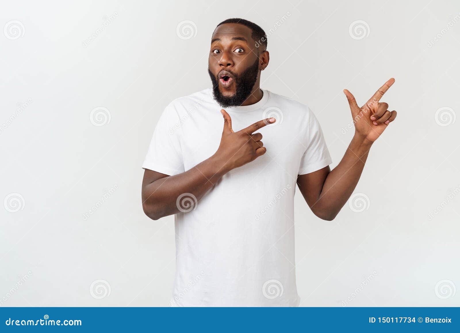 Young Amazed African American Pointing His Finger at White Background ...
