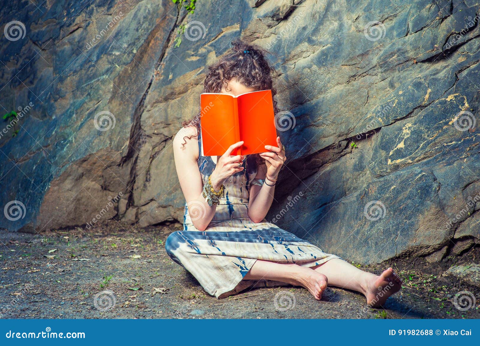 https://thumbs.dreamstime.com/z/young-american-woman-reading-red-book-sitting-ground-thinki-girl-thinking-hard-wearing-long-dress-bracelet-barefoot-pretty-91982688.jpg