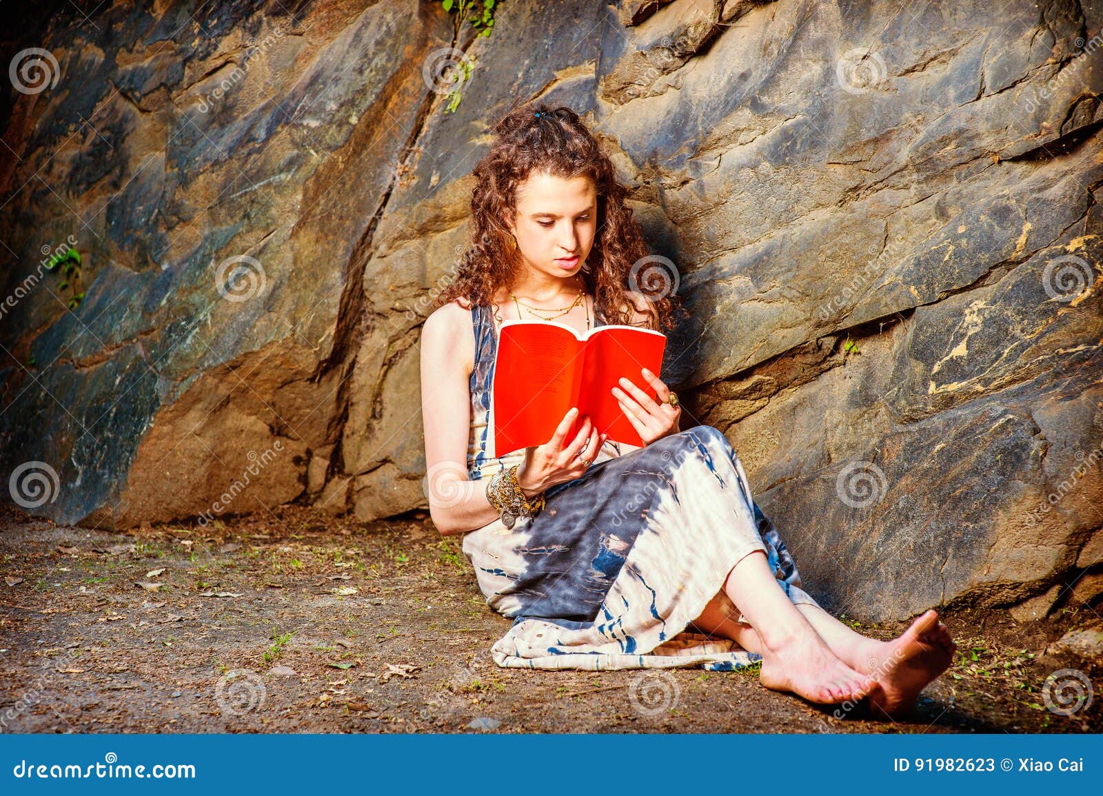 https://thumbs.dreamstime.com/z/young-american-woman-reading-red-book-sitting-ground-travel-girl-outside-wearing-long-dress-bracelet-barefoot-pretty-teenage-91982623.jpg