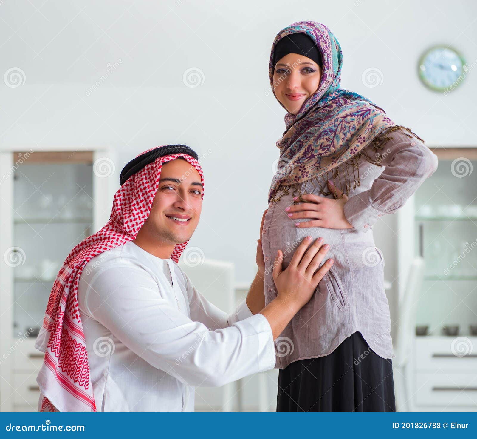 Young Arab Muslim Family With Pregnant Wi