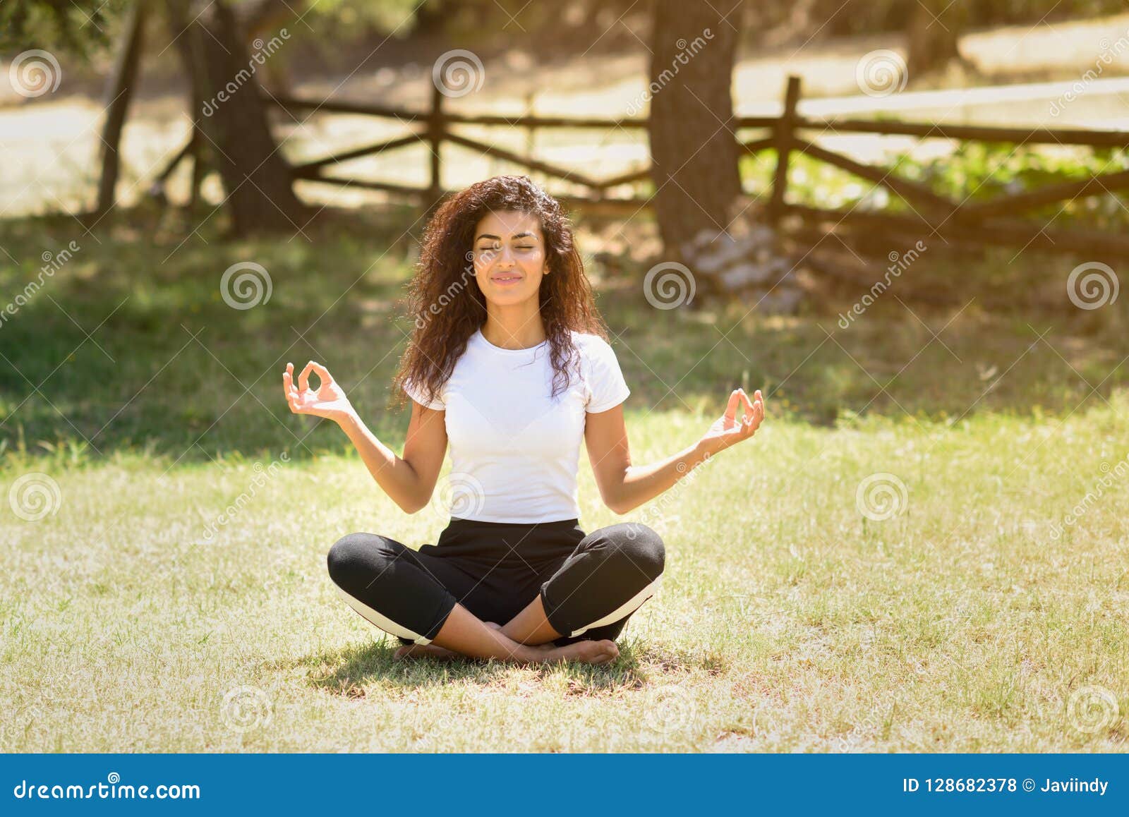 Young Arab Woman Doing Yoga in Nature Stock Photo - Image of ...