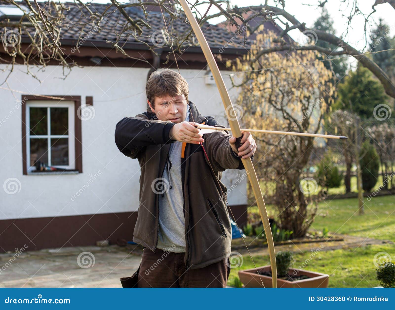 Young Archer Training with the Bow Stock Photo Image of muscle