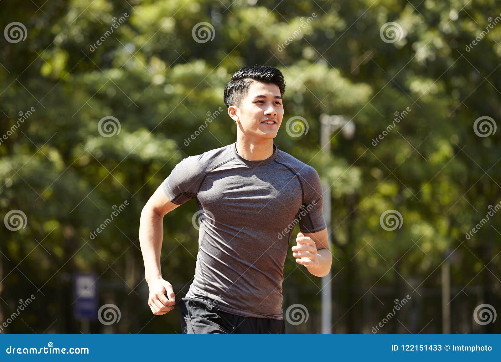 young asian male athlete running