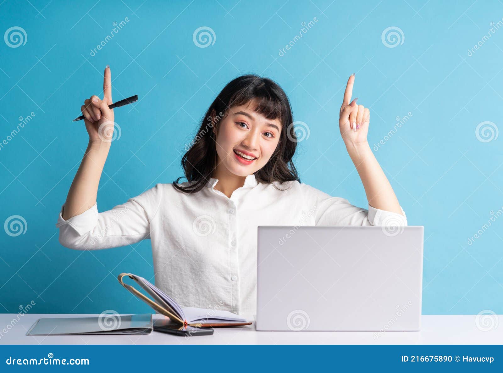 young asian buisness woman working on blue background