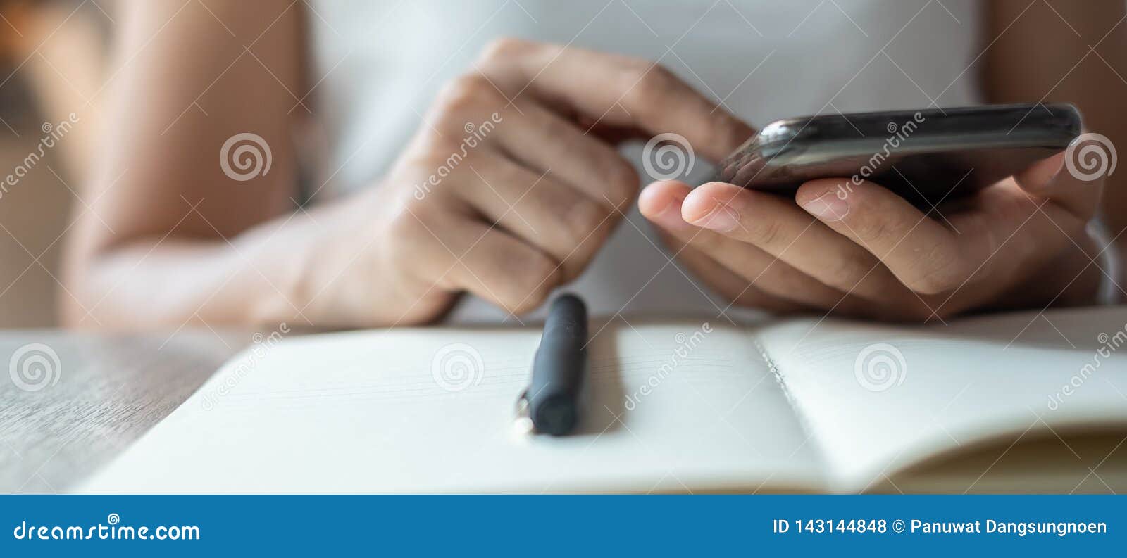 young asian businesswoman using mobile phone in office, woman sitting and hand touching screen on cellphone. smart business and