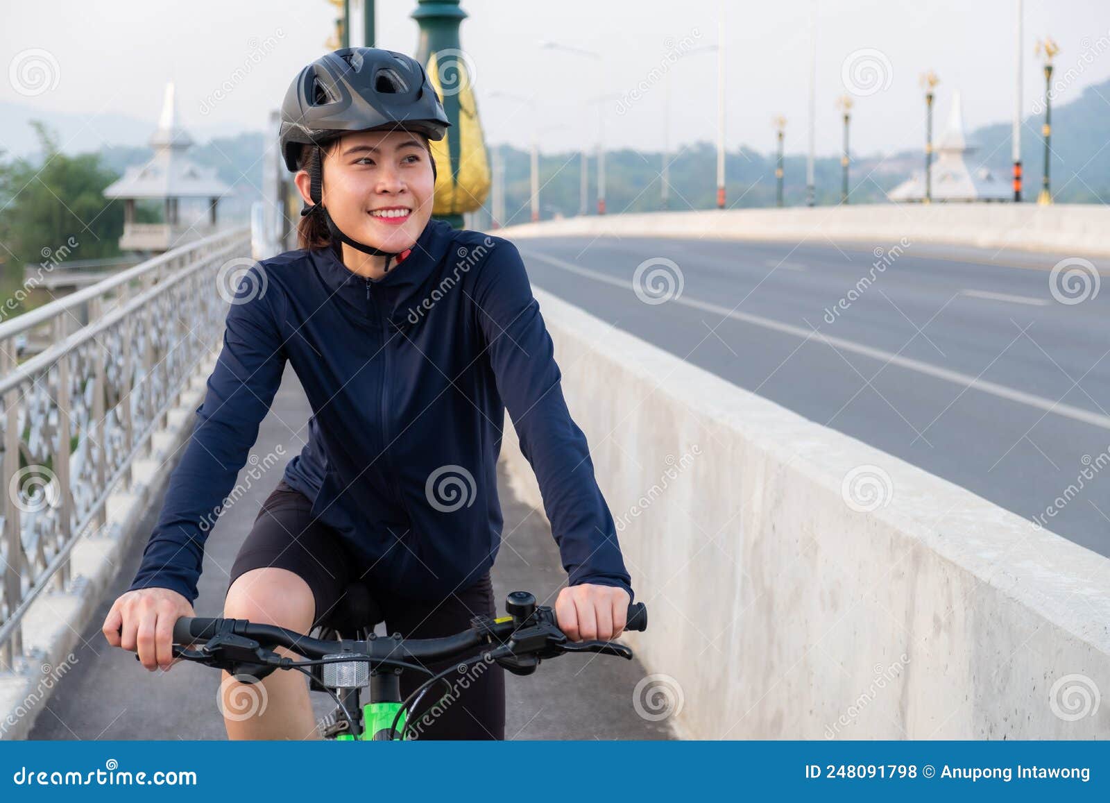 Young Asian Cyclist Woman Exercise by Riding a Bicycle. Stock Photo ...
