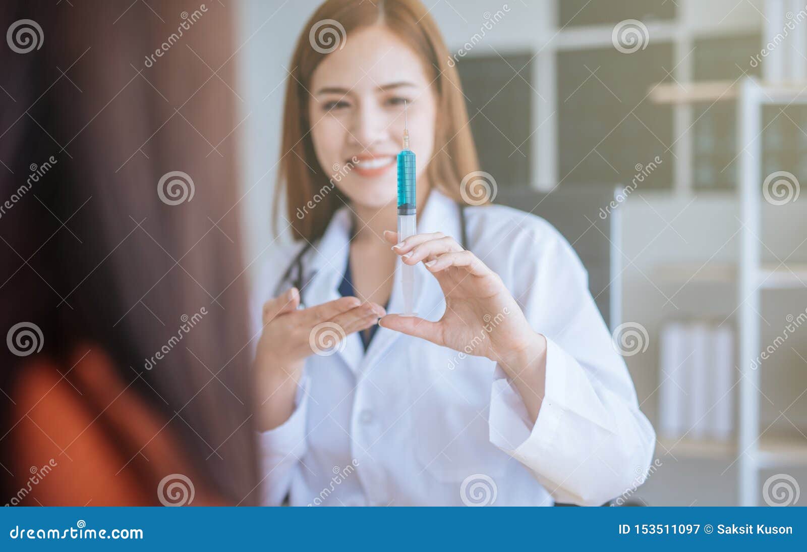 young asian doctor showing hand press syringe ready to inject shot  vaccination and medical injection image.healthcare, medical