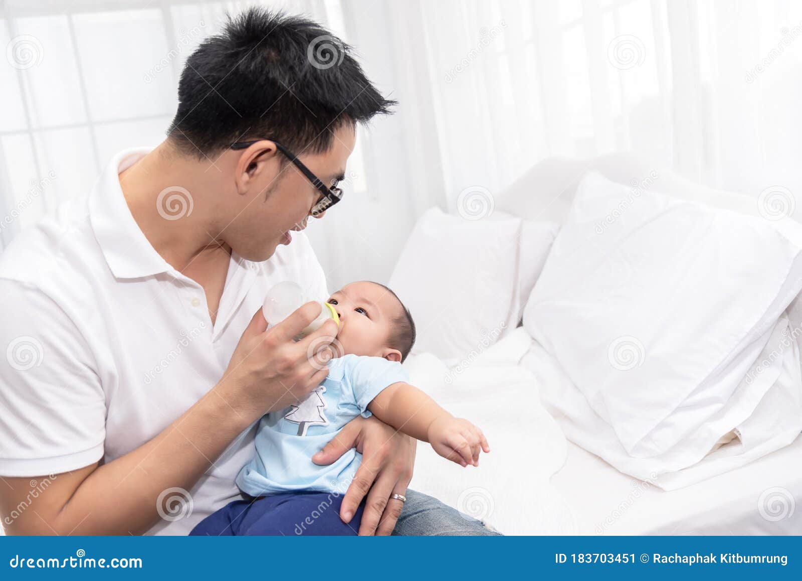 young asian father spending time, take care of baby at home. fatherhood, family concept
