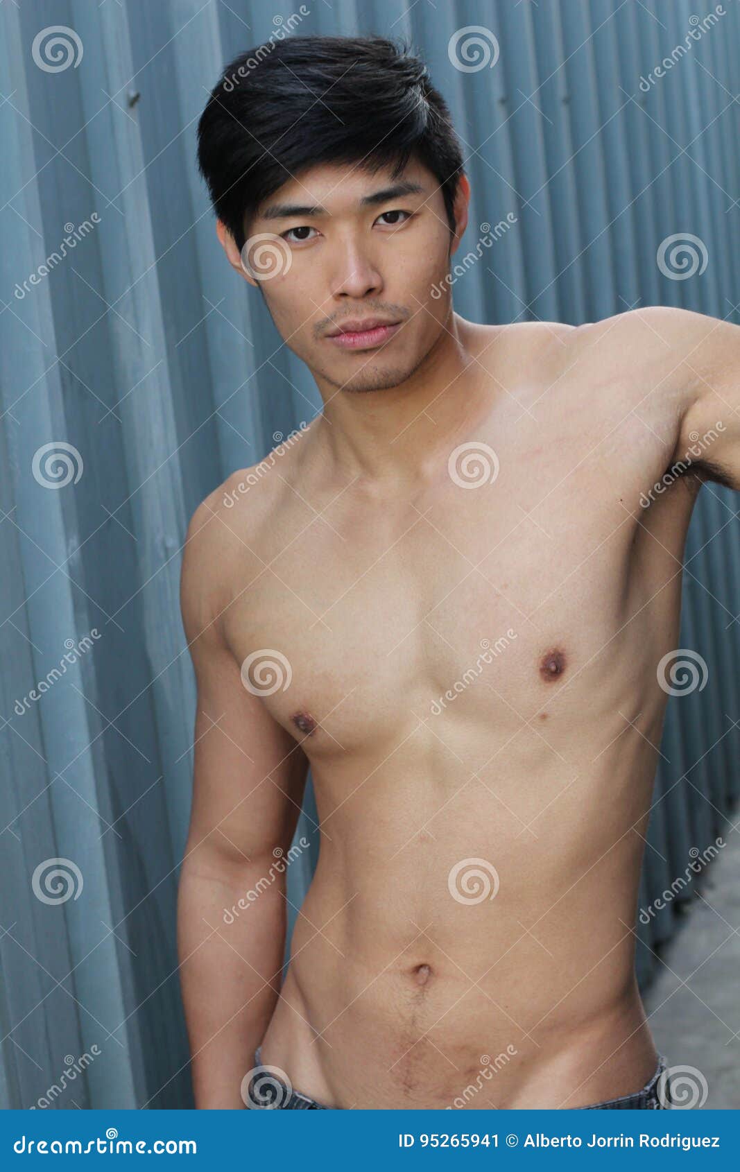 Young Asian Man with Muscular Torso Stock Image