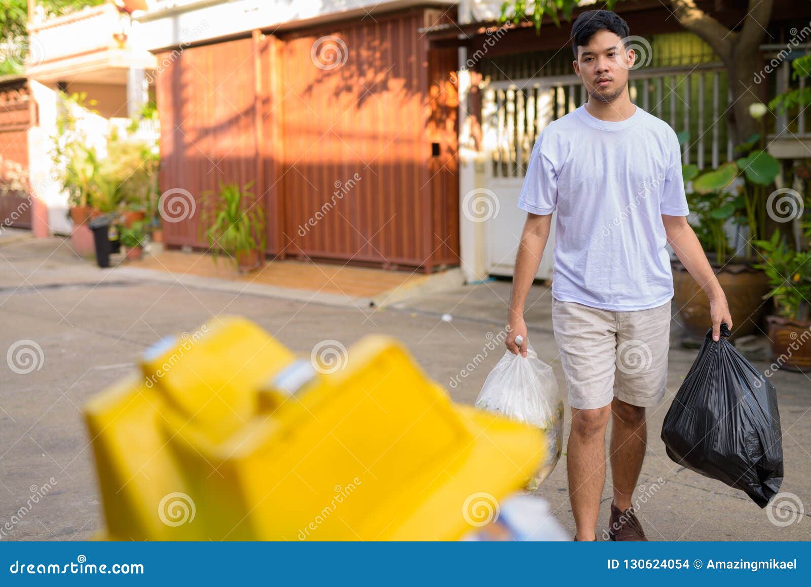Young Asian Man Taking Out the Garbage at Home Stock Photo Image of