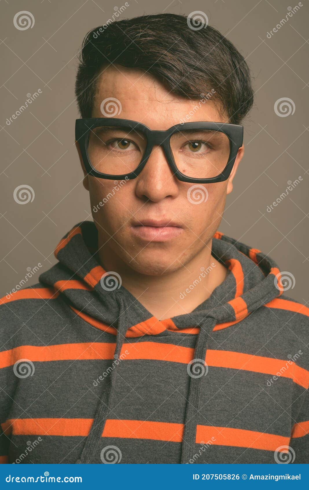 Young Asian Nerd Man Wearing Hoodie Against Gray Background Stock Photo ...