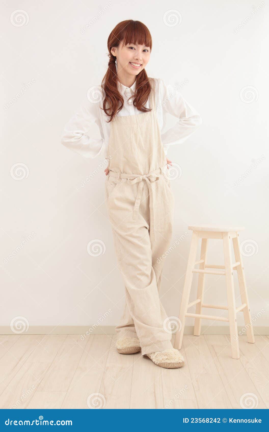Young Asian Woman Dressed In Overalls Stock Photo Image 23568242