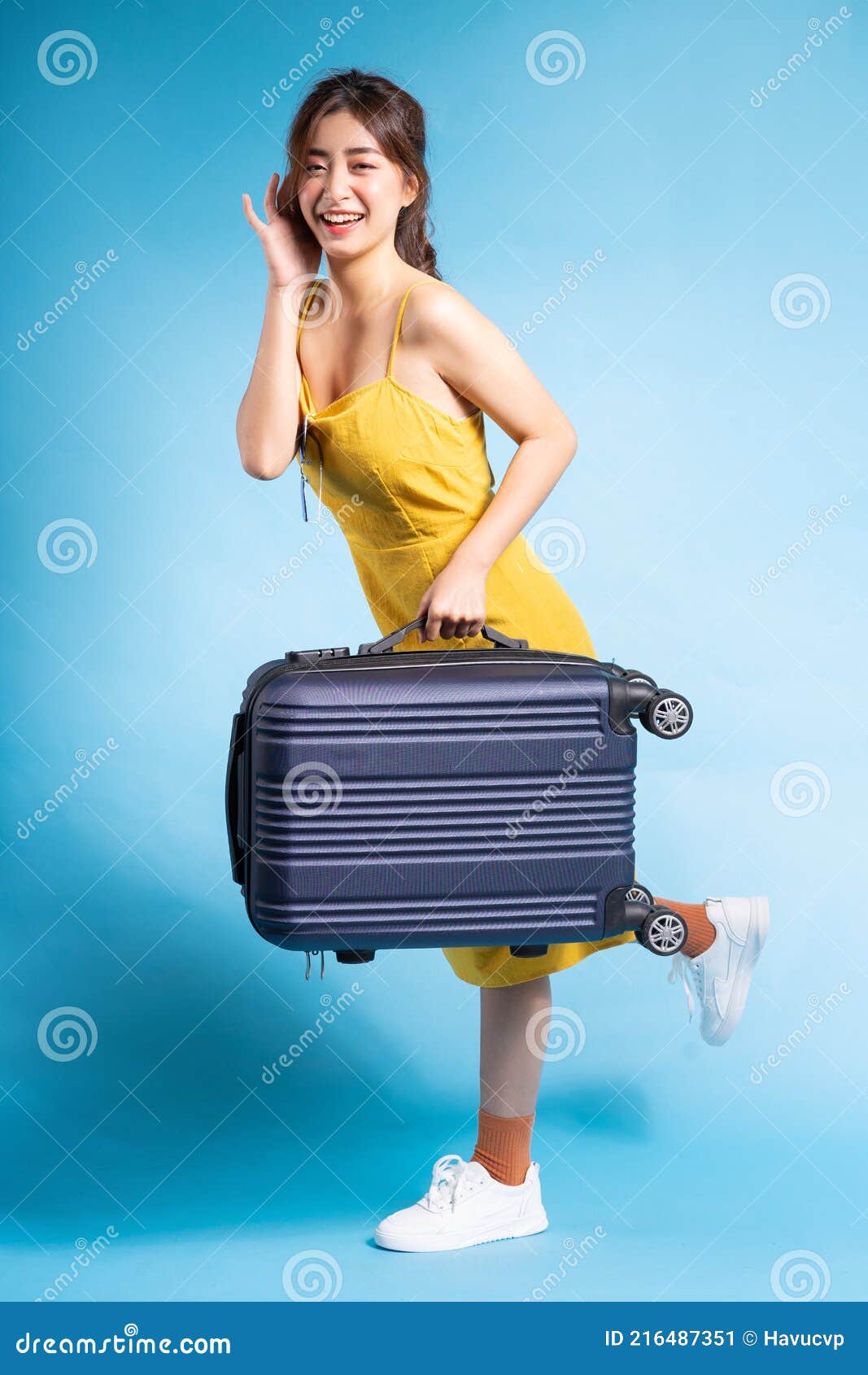 Young Asian Woman Holding Suitcase on Blue Background, Summer Concept ...