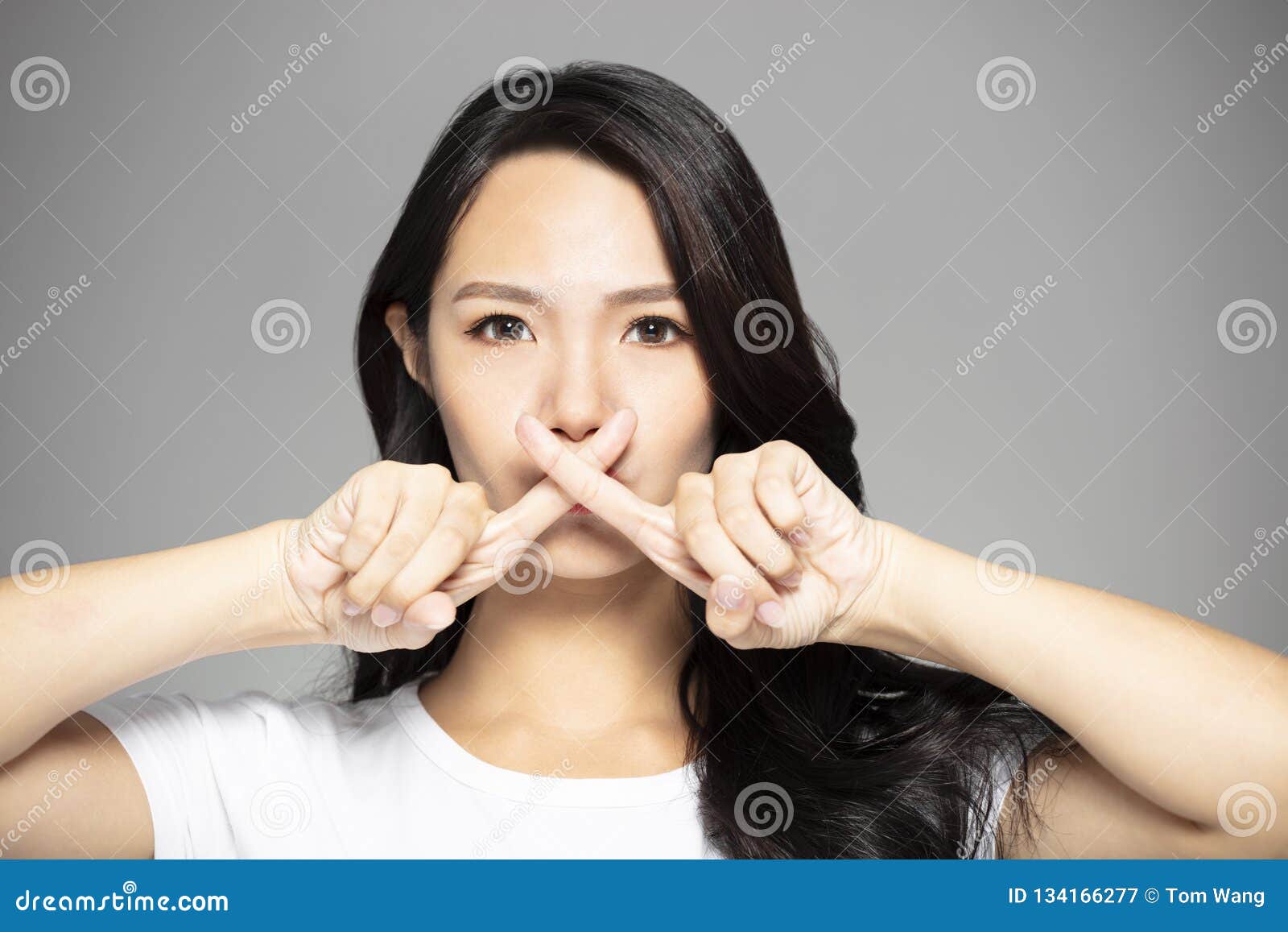 young asian woman with prohibit gesture