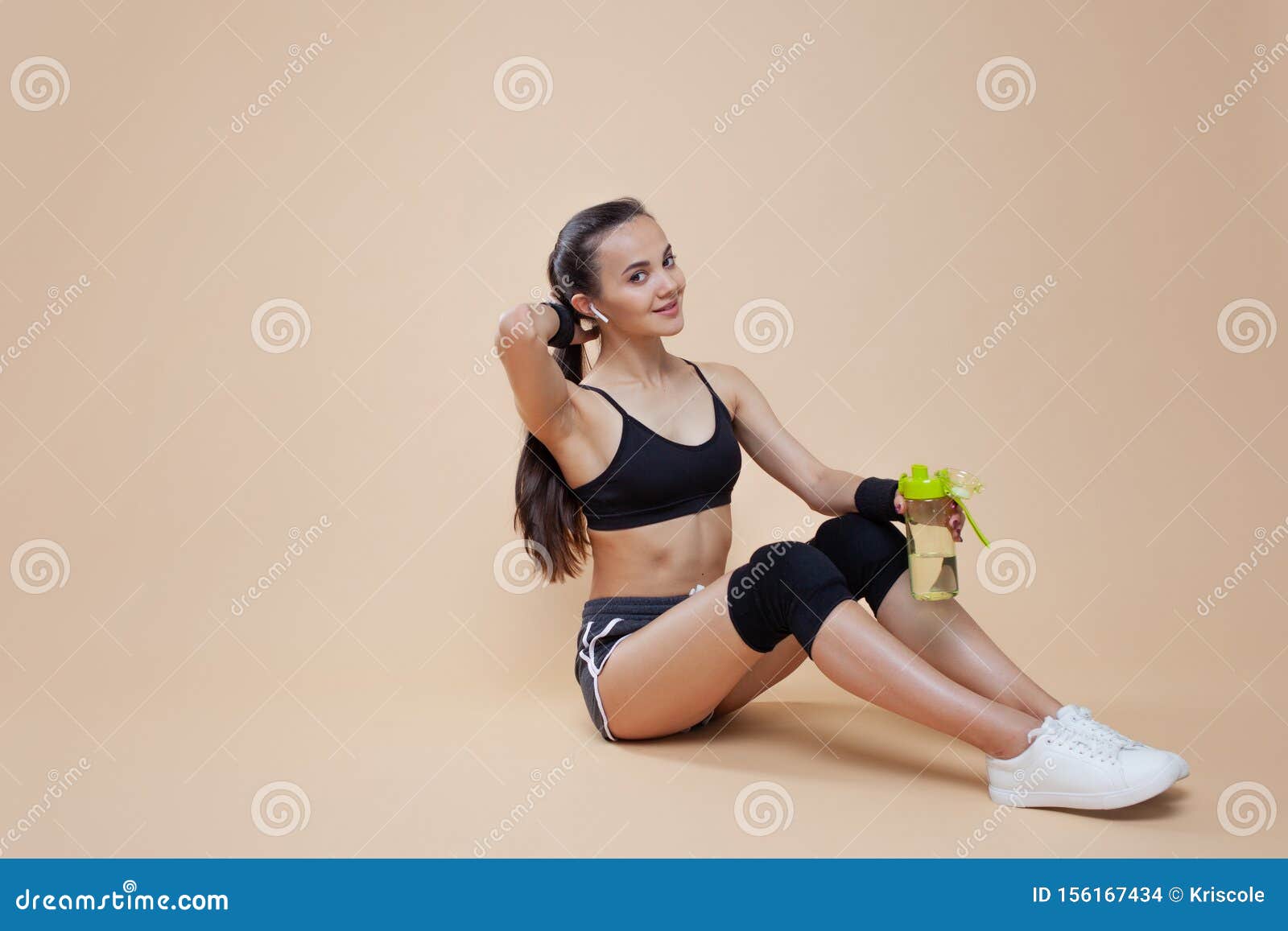 A 20-year-old female trainer practices Pilates on an elevator