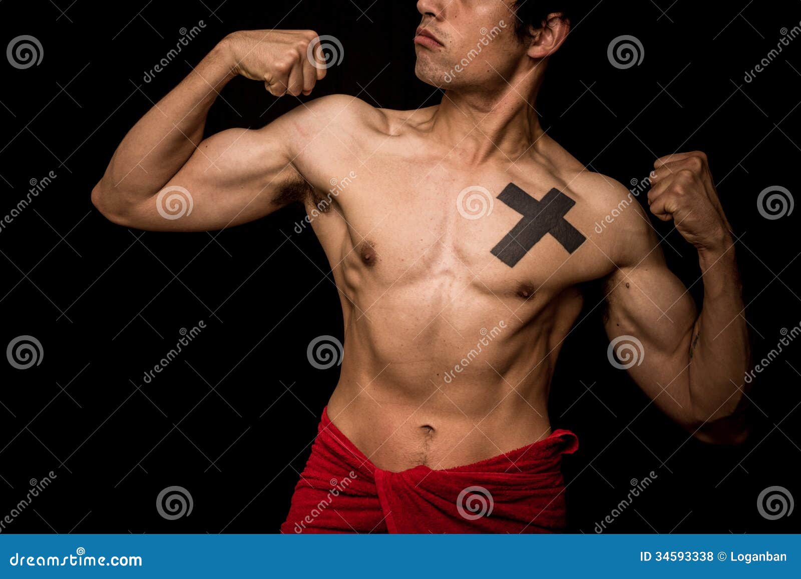 Young Athletic Shirtless Man Posing on Black Background Stock Photo
